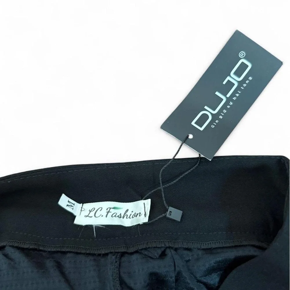 Black pleated mini skirt in size M